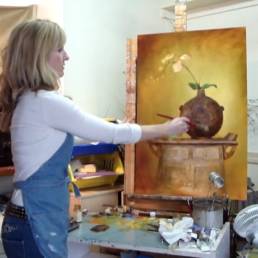 artist painting a still life flower artwork demo