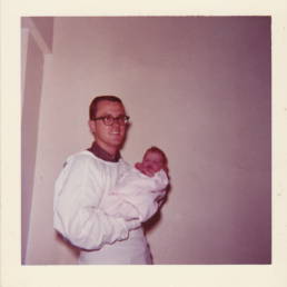 dad holding baby