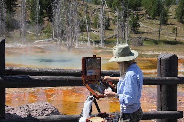 artist painting in yellowstone